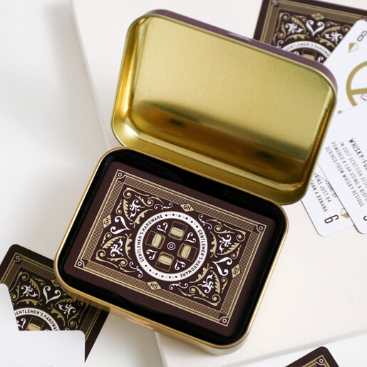 Gentlemen's Hardware Whisky Playing Cards in Open Tin on White Background with Scattered Cards