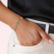 Green Enamel Star Sun and Moon Charm Bracelet in Gold on Model with Hand in Pocket