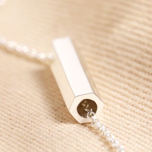 Close up of Charm on Hexagonal Barrel Pendant Bracelet in Silver