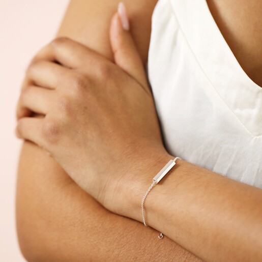 Model with crossed arms wearing Hexagonal Barrel Pendant Bracelet in Silver