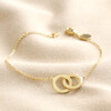 Interlocking Matte Hoops Bracelet in Gold on Beige Fabric