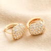 Clear Crystal Pavé Square Huggie Hoop Earrings in Gold  on Beige Fabric