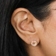 Close Up of Model Wearing Enamel Doughnut Stud Earrings in Gold