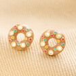 Enamel Doughnut Stud Earrings in Gold on Beige Fabric