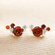 Close up of January Birthstone Cluster Stud Earrings in Silver on top of neutral fabric