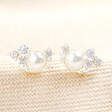 Close up of June Birthstone Cluster Stud Earrings in Silver on top of neutral fabric