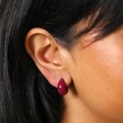 Close Up of Model Wearing Purple Domed Resin Hoop Earrings