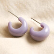 Purple Resin Domed Huggie Hoop Earrings on beige coloured material