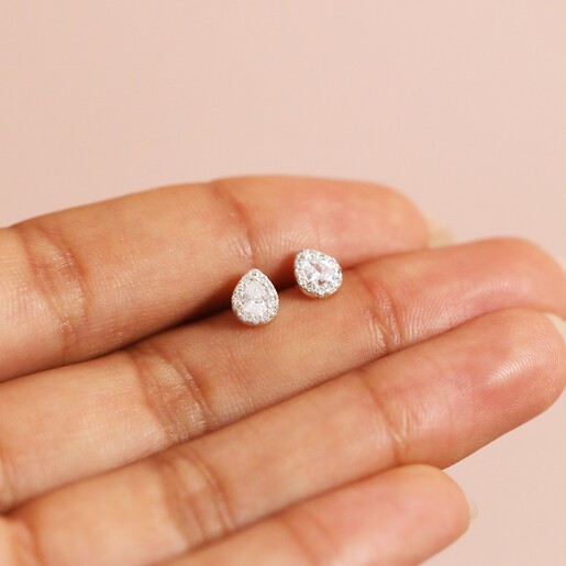 Sterling Silver Crystal Teardrop Stud Earrings Held Between Model's Fingers