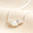 June Birthstone Cluster Necklace in Silver on Beige Fabric