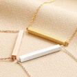 Women's Horizontal Bar Necklace in Rose Gold with gold and silver versions on beige coloured materialBar Necklaces in Rose Gold, Gold or Silver