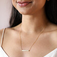 Horizontal Bar Necklace in Gold on model smiling