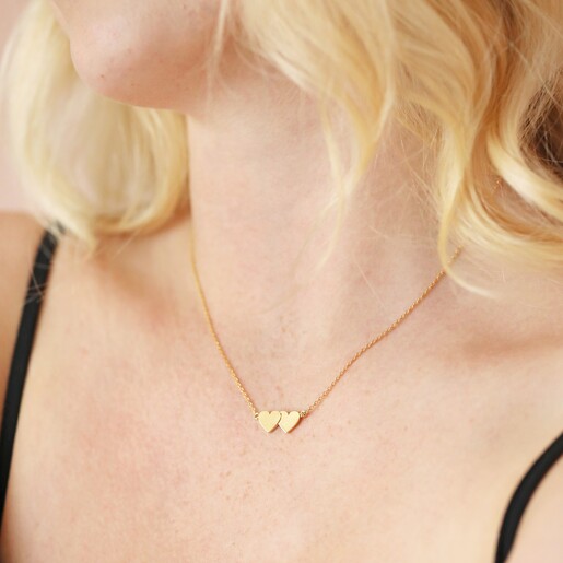 Necklace on Model Close up of Linked Hearts Pendant Necklace in Gold on Model
