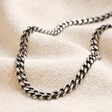 Men's Black Stainless Steel Curb Chain Necklace on beige fabric