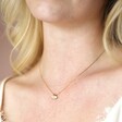 Close Up of Model Wearing Mum and Baby Elephant Charm Necklace in Gold