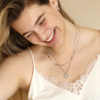 Model smiling wearing Personalised Stainless Steel Zodiac Pendant Necklace in curated look