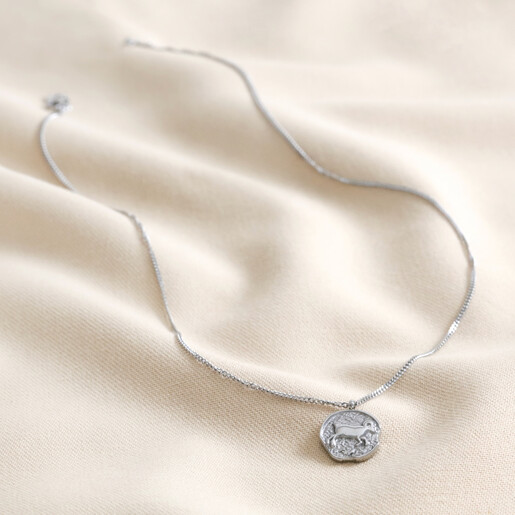 Full Chain Full Chain of Stainless Steel Aries Pendant Necklace on Beige Fabric