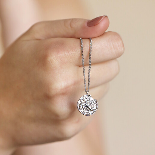 Necklace Held by Model Stainless Steel Leo Pendant Necklace Held in Model's hand