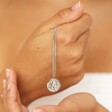 Model holding the Stainless Steel Sagittarius Pendant Necklace