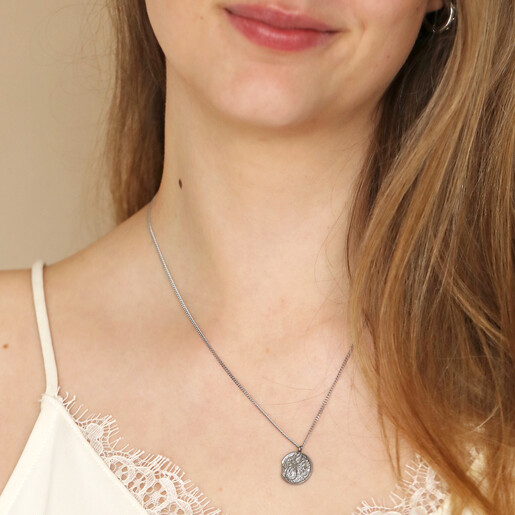 Close Up of Stainless Steel Scorpio Pendant Necklace on Model