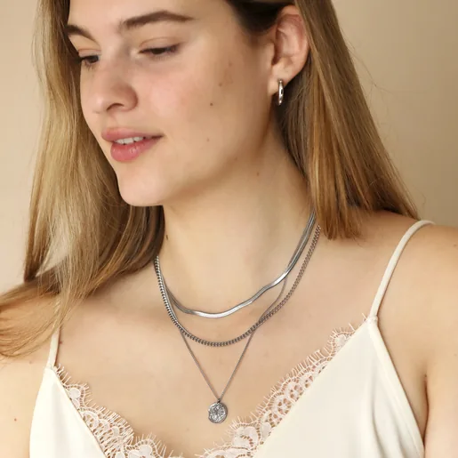 Stainless Steel Scorpio Pendant Necklace Layered with other necklaces on model