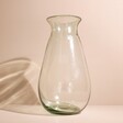 Large Glass Flower Vase Against Neutral Background 