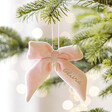 Personalised Pink Velvet Bow Hanging Decoration hanging from tree branch