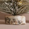 Close up of base on Small Light Up LED Tree Ornament against natural background