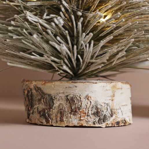 Close up of base on Small Light Up LED Tree Ornament against natural background