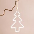 Woven Rope Tree Hanging Decoration hanging from tree branch against neutral background
