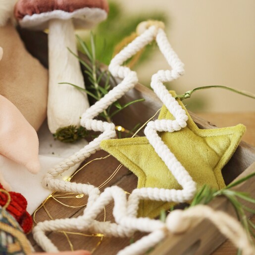 Close up of Woven Rope Tree Hanging Decoration against other decorations