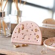 Celestial Earring Holder in lifestyle shot on top of wooden counter with jewellery inside