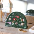 Forest Green Flower Earring Holder in lifestyle shot with earrings in