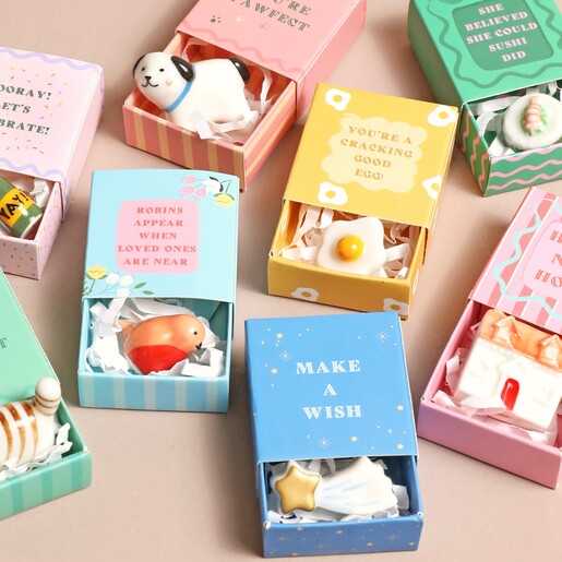 Other Matchbox Tokens Available Tiny Matchbox Ceramic Tokens on pain pink surface