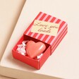 Tiny Matchbox Love You Ceramic Heart Token in Box on Beige Surface