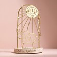 Sunshine Personalised Jewellery Stand with Terrazzo Base against pink background with jewellery on