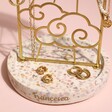 Close up of sunshine Personalised Jewellery Stand with Terrazzo Base with jewellery in