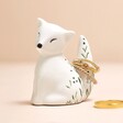 Ceramic Fox Ring Holder Holding Rings On Pink Surface