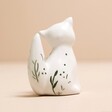 Back of Ceramic Fox Ring Holder on Pink Surface