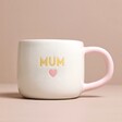 Ceramic Pink Heart Mum Mug in front of neutral coloured background