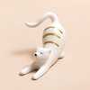 Ceramic Stretching Cat Ring Holder on Pink Surface