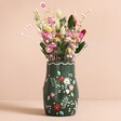 Forest Green Flower Vase with dried flowers inside in front of beige coloured backdrop