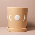 Large Moon Phases Ceramic Planter and Tray on Beige Backdrop