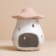 Pink Ceramic Toadstool Wax Burner without candle inside against beige coloured backdrop