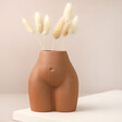 Small Porcelain Body Vase with dried bunny tails inside