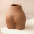 Back of Small Porcelain Body Vase on neutral coloured background