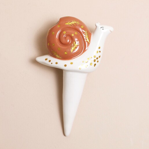 Snail Plant Watering Spike on beige background