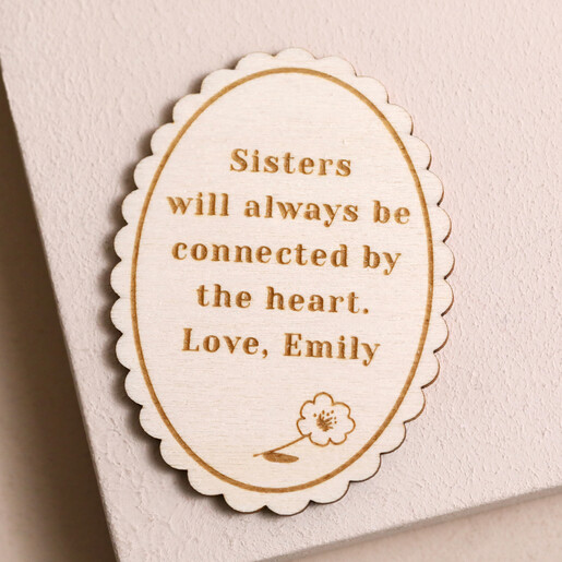 Personalised Scalloped Oval Sun Token on plain background