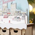 Close up of details on Personalised Wooden Market Cutout Advent Calendar topper