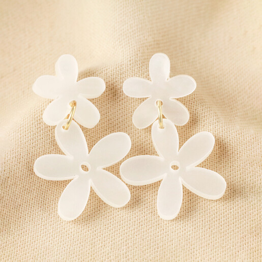 Pearlescent Acrylic Flower Drop Earrings against neutral coloured fabric